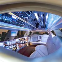 Limo with mirrored tile ceiling with Denver in the background