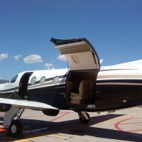 private jet with cargo door open
