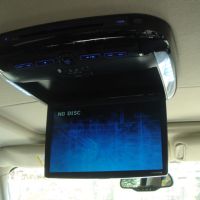 Drop down digital screen for viewing entertainment interior of the limo
