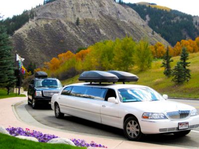 Stagecoach Limos at a special event with fall colors and Colorado mountains in the background